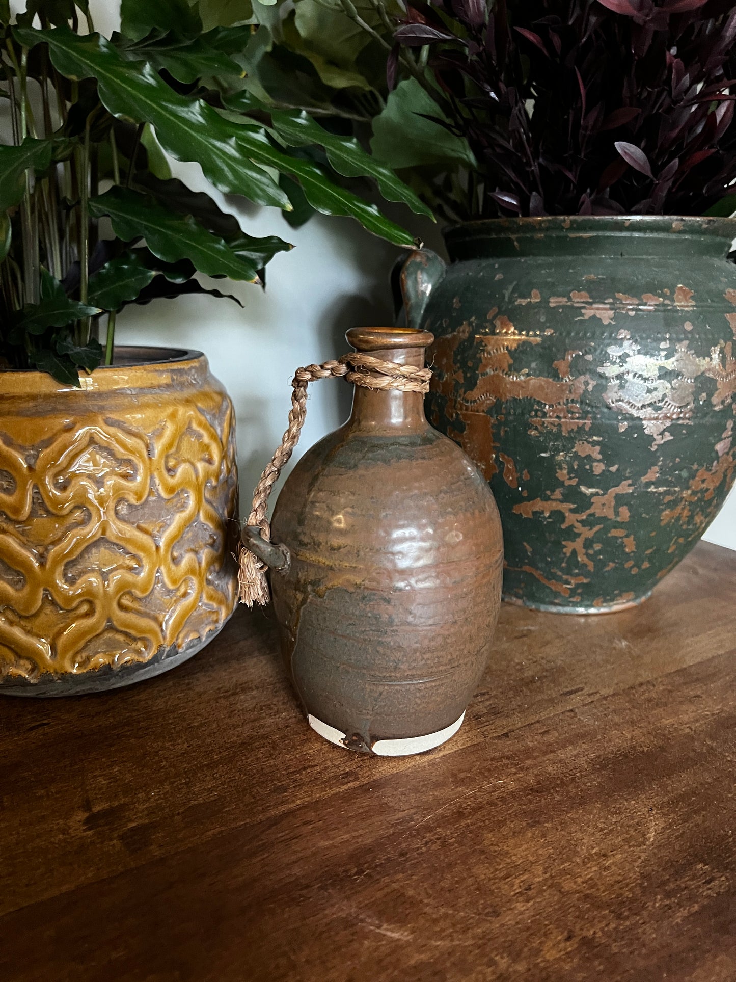 Rustic glazed vessel with twine handle