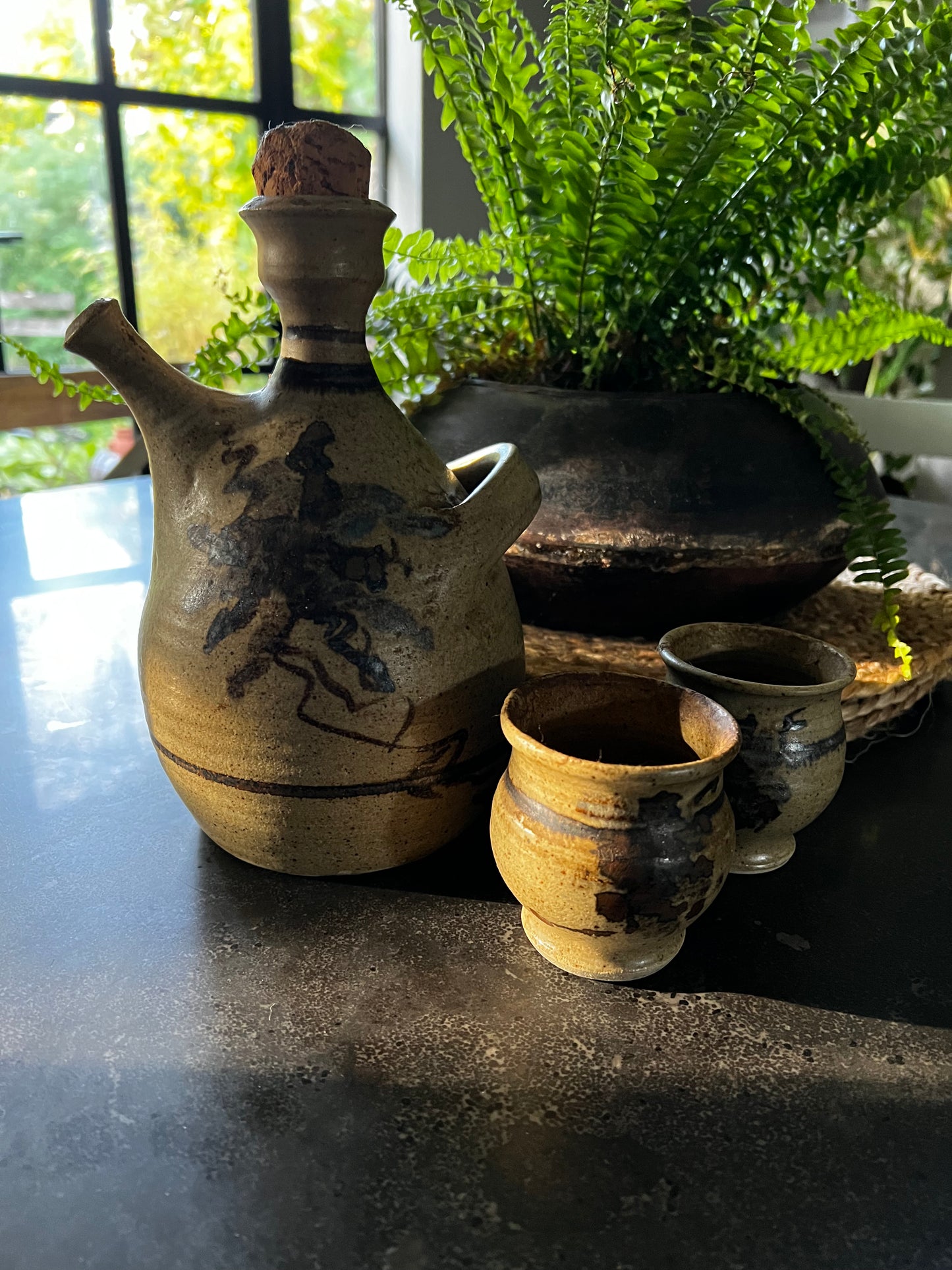 Stoneware carafe and drinking cups